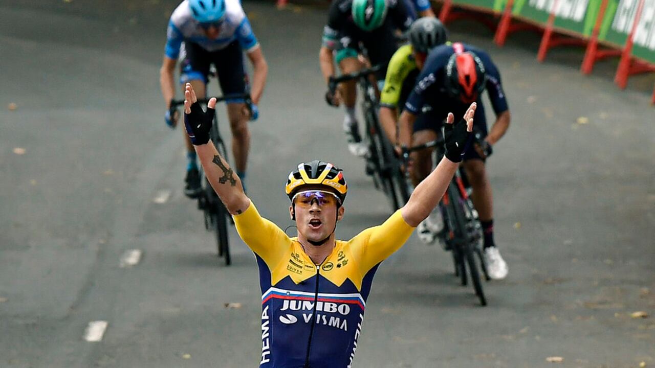 Jumbo-Visma's Primoz Roglic, celebrates after winning the first stage of La Vuelta between Irun and Arrate, in northern Spain, Tuesday, Oct. 20, 2020. Defending champion Roglic attacked in the final kilometer after a difficult climb to win the opening stage of the Spanish Vuelta. (AP Photo/Alvaro Barrientos)