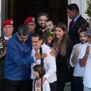 Venezuelan President Maduro, center left, embraces Alex Saab after Saab arrived at Miraflores presidential palace in Caracas, Venezuela, Wednesday, Dec. 20, 2023. The United States freed Saab, who was arrested on a U.S. warrant for money laundering in 2020, in exchange for the release of 10 Americans imprisoned in Venezuela, the Biden administration announced Wednesday. (AP Photo/Matias Delacroix)