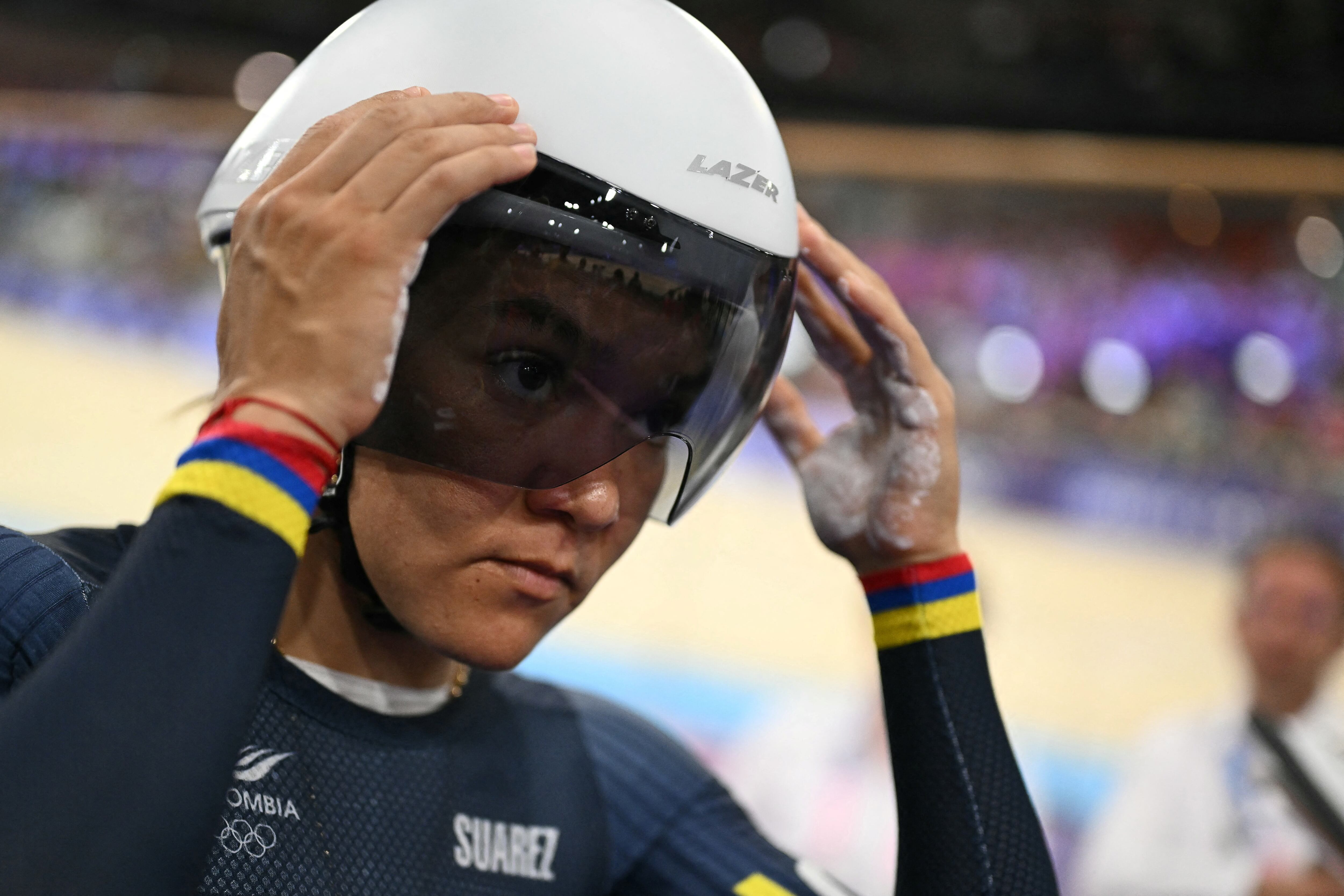 Colombia's Martha Bayona Pineda prepares to compete in a women's track cycling sprint qualifying round of the Paris 2024 Olympic Games at the Saint-Quentin-en-Yvelines National Velodrome in Montigny-le-Bretonneux, south-west of Paris, on August 9, 2024. (Photo by SEBASTIEN BOZON / AFP)