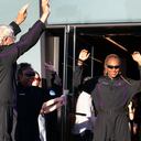 Space tourists, from right, Keisha Schahaff, her daughter Anastatia Mayers, both from the Caribbean island of Antigua, and British Jon Goodwin wave to the crowd before boarding their Virgin Galactic flight at Spaceport America, near Truth or Consequences, N.M., Thursday, Aug. 10, 2023. Virgin Galactic is taking its first space tourists on a long-delayed rocket ship ride. (AP Photo/Andrés Leighton)