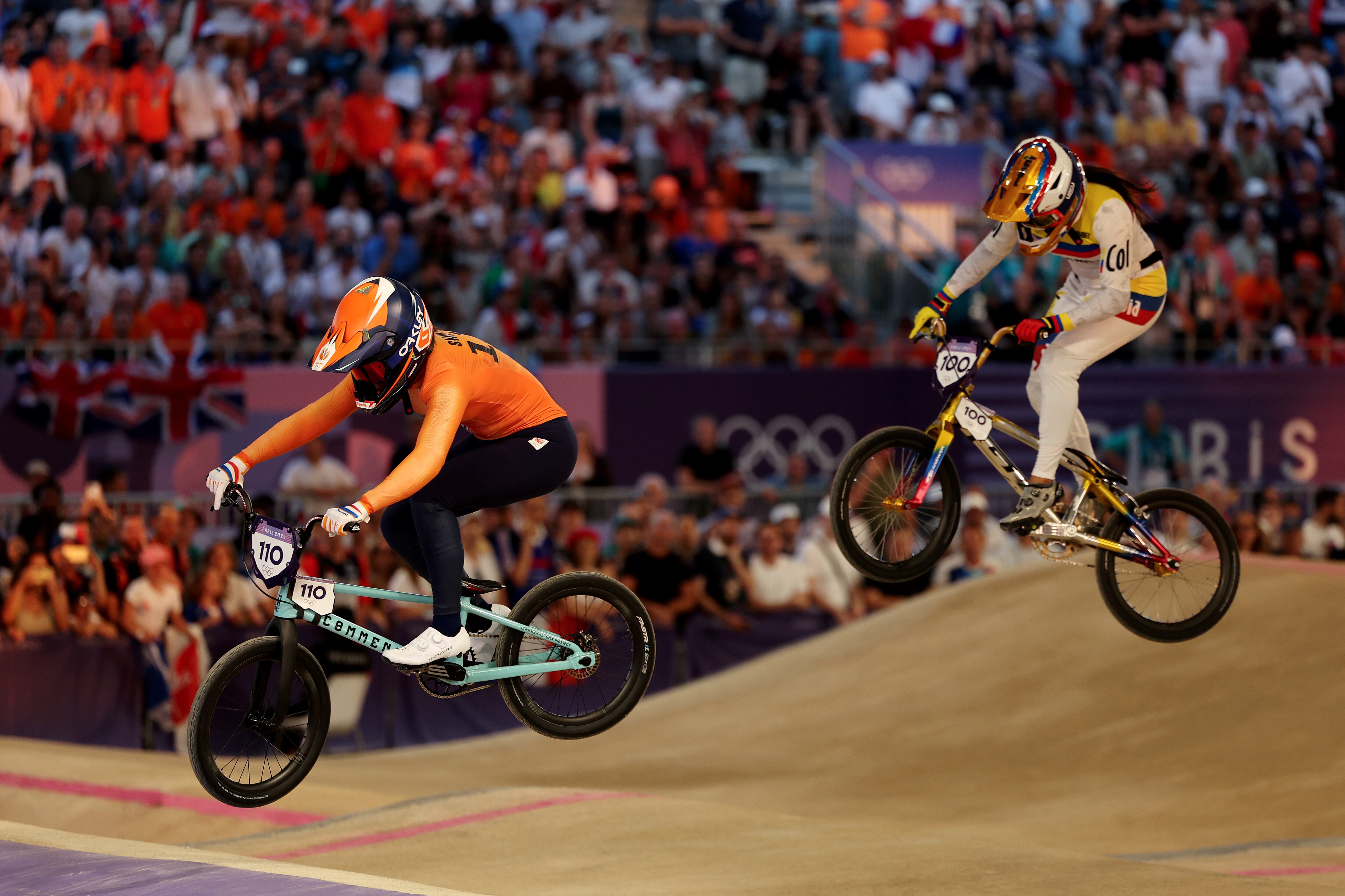 PARIS, FRANCE - AUGUST 02: Laura Smulders of Team Netherlands and Mariana Pajon Londono of Team Colombia compete during the Women's Semi-Finals Run 2, Heat 2 on day seven of the Olympic Games Paris 2024 at Saint-Quentin-en-Yvelines BMX Stadium on August 02, 2024 in Paris, France. (Photo by Tim de Waele/Getty Images)