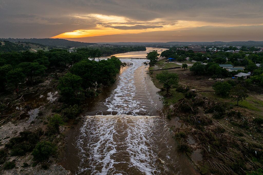 KERRVILLE, TEXAS - JULY 06: In an aerial view, the sun sets over the Guadalupe River on July 06, 2025 in Kerrville, Texas. Heavy rainfall caused severe flooding along the Guadalupe River in central Texas, leaving more than 80 people reported dead. (Photo by Brandon Bell/Getty Images)