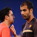 ROME - MAY 26: Josep Guardiola coach of Barcelona speaks to Xavi during the Barcelona training session prior to UEFA Champions League Final versus Manchester United at the Stadio Olimpico on May 26, 2009 in Rome, Italy. (Photo by Jasper Juinen/Getty Images)