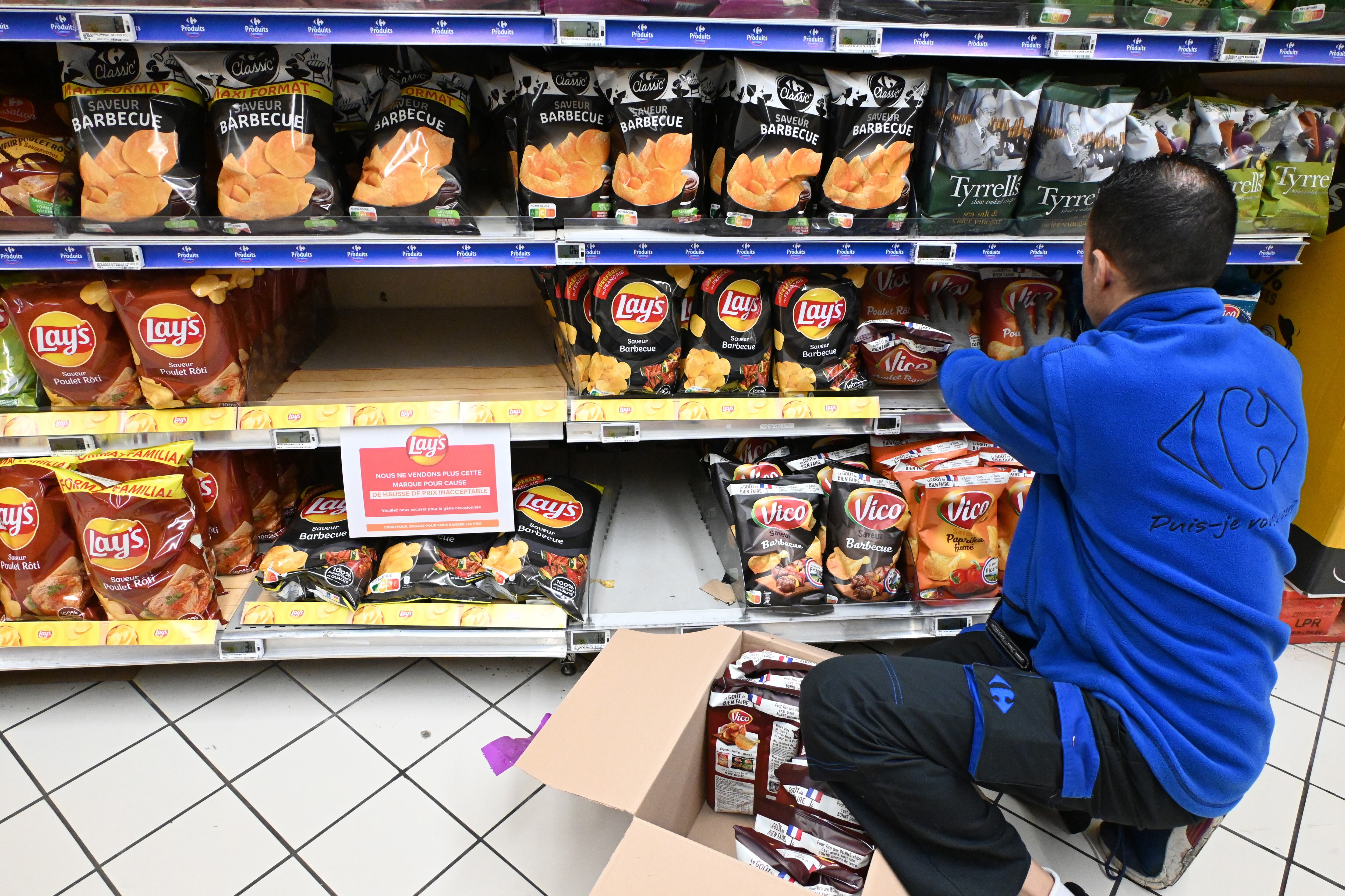 PARIS, FRANCE - JANUARY 05: A sign reading in French in a Carrefour on a shelf for the PepsiCo product Doritos' reads: 'We no longer sell this brand due to unacceptable price increases' at a Carrefour Group store in Montigny-le-Bretonneux, near Paris, France on January 05, 2024. French Multinational retail and wholesaling corporation Carrefour, stop selling PepsiCo products in their stores in four European countries due to prices. (Photo by Mustafa Yalcin/Anadolu via Getty Images)
