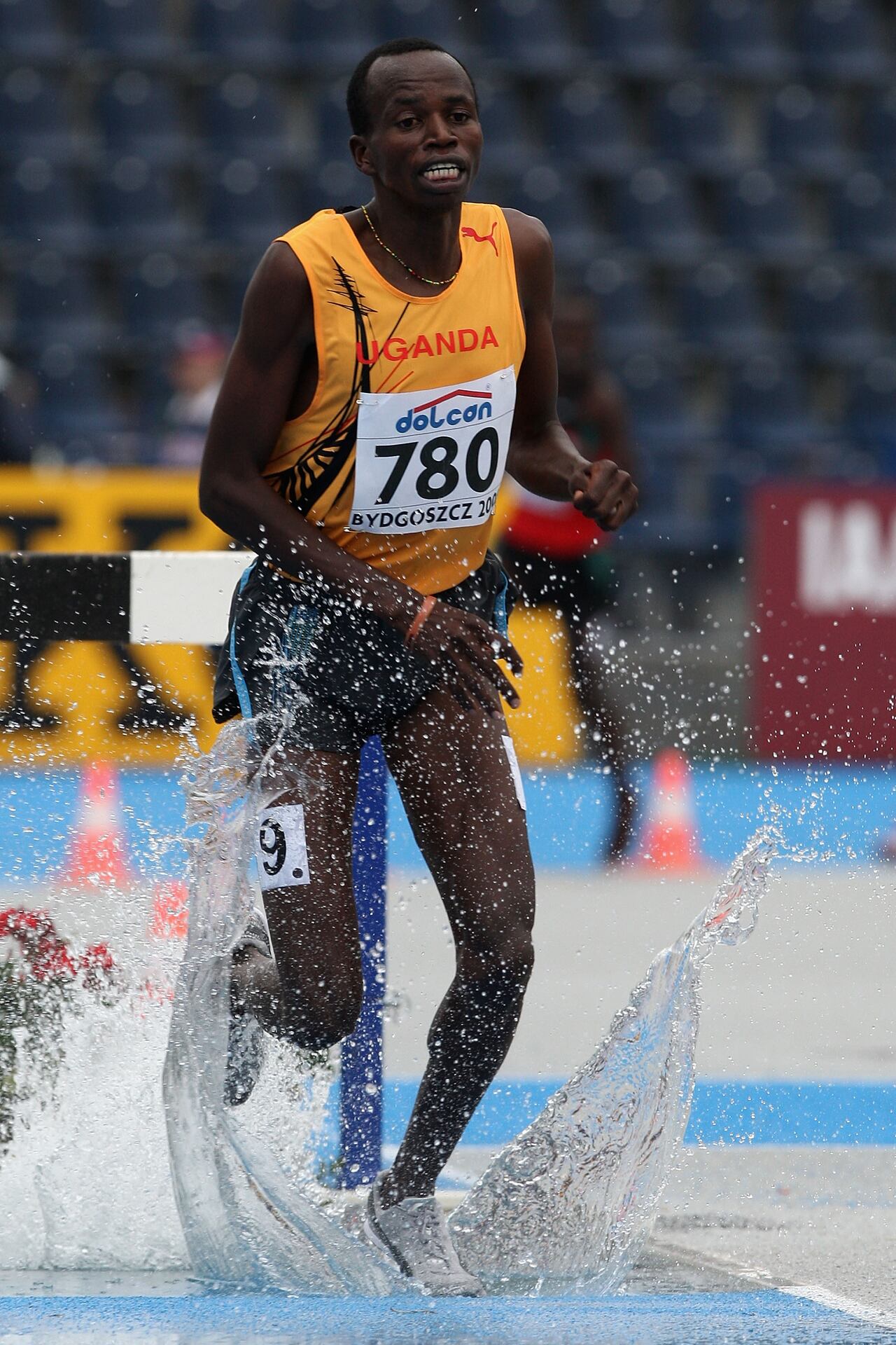 BYDGOSZCZ, POLAND - JULY 13:  Benjamin Kiplagat of Uganda in action on his way to 2nd place during the final of the men's 300m steeplechase with Dereje Abdi of Ethiopia following during day six of the 12th IAAF World Junior Championships at the Zawisca Stadium on July 13, 2008 in Bydgoszcz, Poland.  (Photo by Hamish Blair/Getty Images)