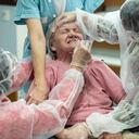 A woman is tested with a PCR COVID-19 test in a nursing home in Ammerschwihr, eastern France, Monday, Nov.9, 2020. The situation in hospitals and nursing homes is grim, with emergency wards approaching saturation and some sick patients being evacuated from struggling hospitals to others that still had space. With more than 1.8 million infections since the start of the health crisis, France has Europe's highest cumulative total of recorded cases and the fourth-highest worldwide. (AP Photo/Jean-Francois Badias)