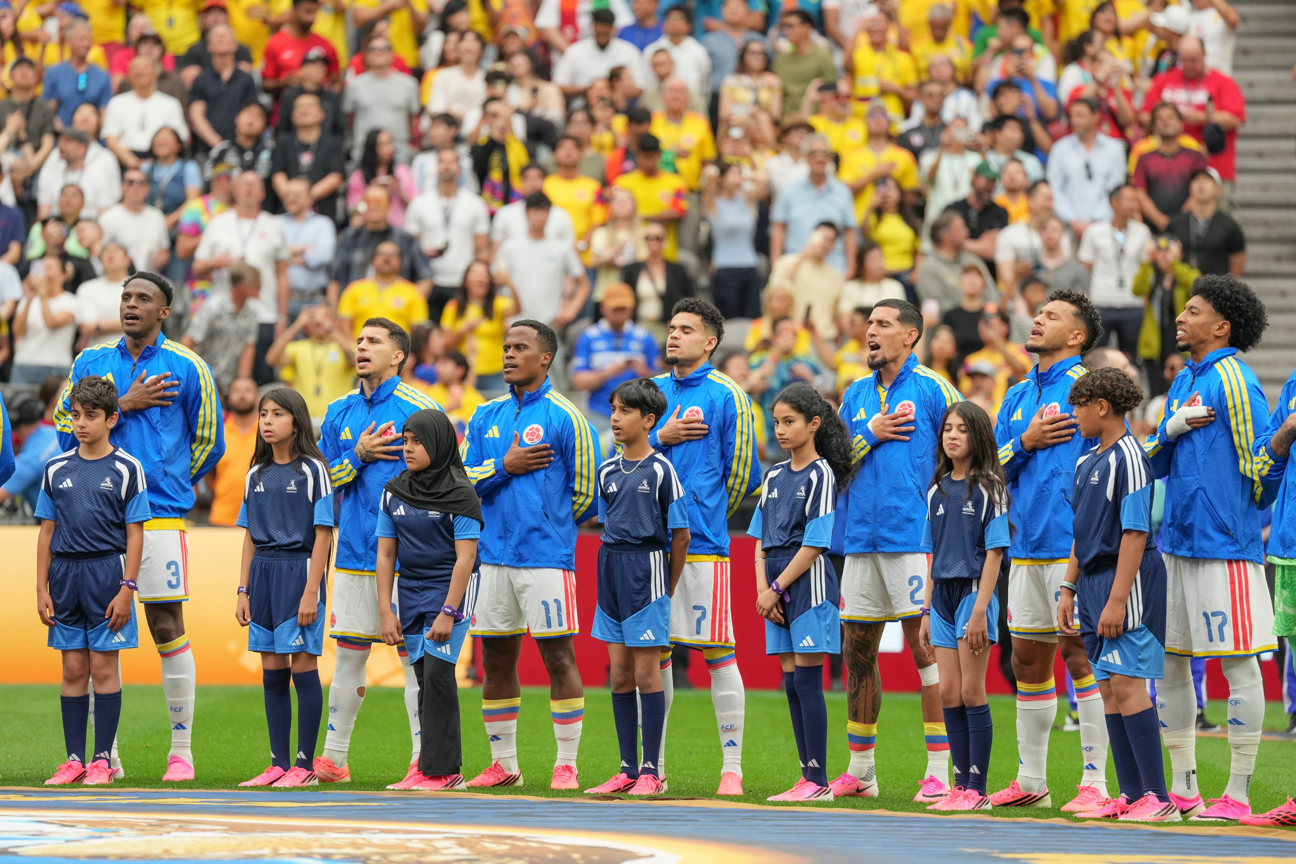 VANCOUVER, CANADA - JULY 7: Colombian players stand for their national anthem before the FIFA World Cup 2026 Round Of 16 match between Switzerland and Colombia at BC Place Vancouver on July 7, 2026 in Vancouver, Canada. (Photo by Christopher Morris/ISI Photos/ISI Photos via Getty Images)