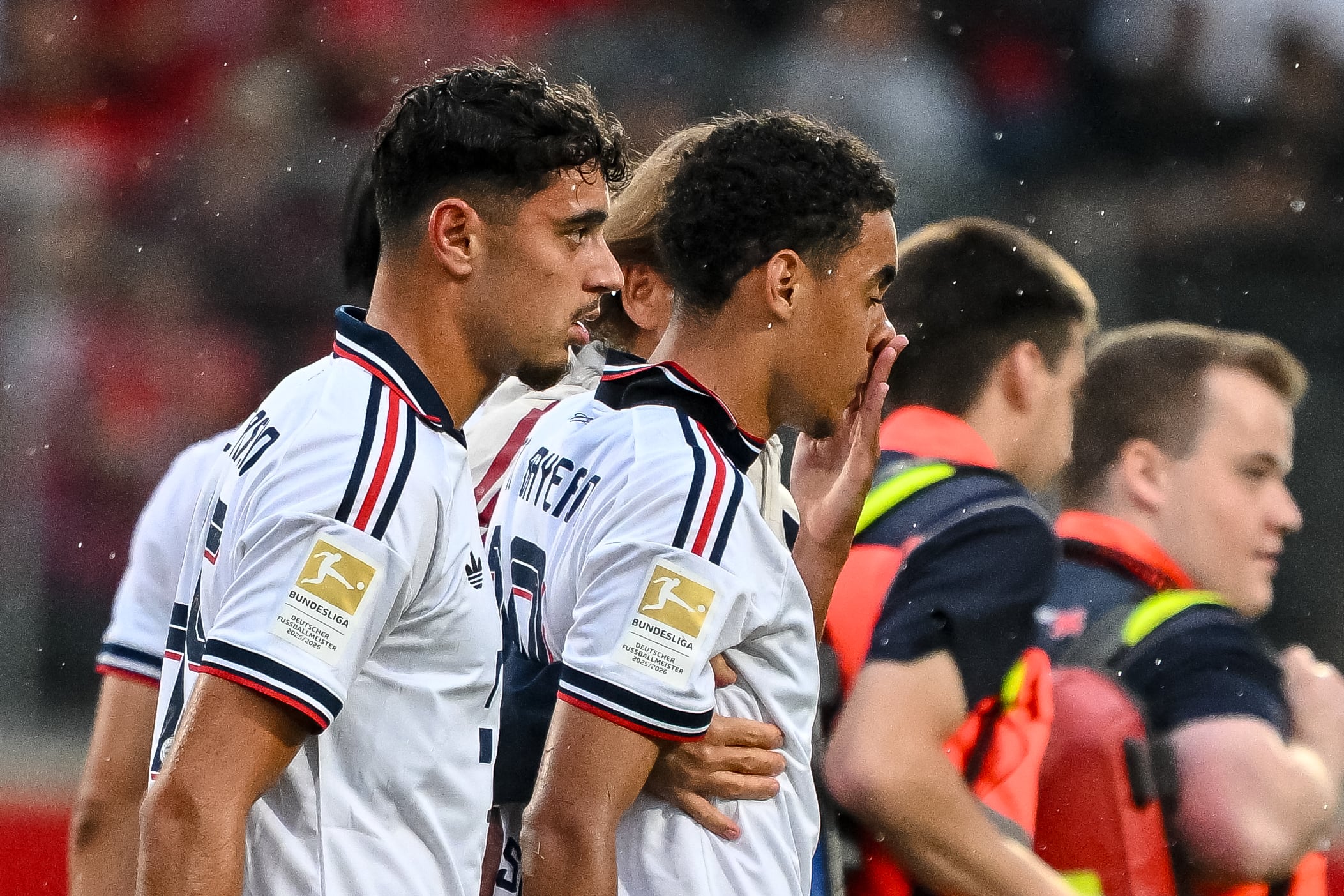 Bayern's Jamal Musiala, second left, leaves the field during a friendly soccer match between FC Heidenheim and FC Bayern Munich in Heidenheim, Germany, Tuesday, Aug. 18, 2026. (Harry Langer/DeFodi/dpa via AP)