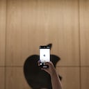 WUHAN, CHINA - MAY 21: A customer uses an iPhone to take photos of the Apple logo inside a new Apple store at Wuhan International Plaza on May 21, 2022 in Wuhan, Hubei Province of China. (Photo by VCG/VCG via Getty Images)