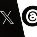 Twitter X logo displayed on a phone screen and Threads logo displayed on a laptop screen are seen in this illustration photo taken in Warsaw, Poland on July 26, 2023. (Photo by Jakub Porzycki/NurPhoto via Getty Images)