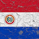 Flag of Paraguay painted on cracked dirty wall. National pattern on vintage style surface.