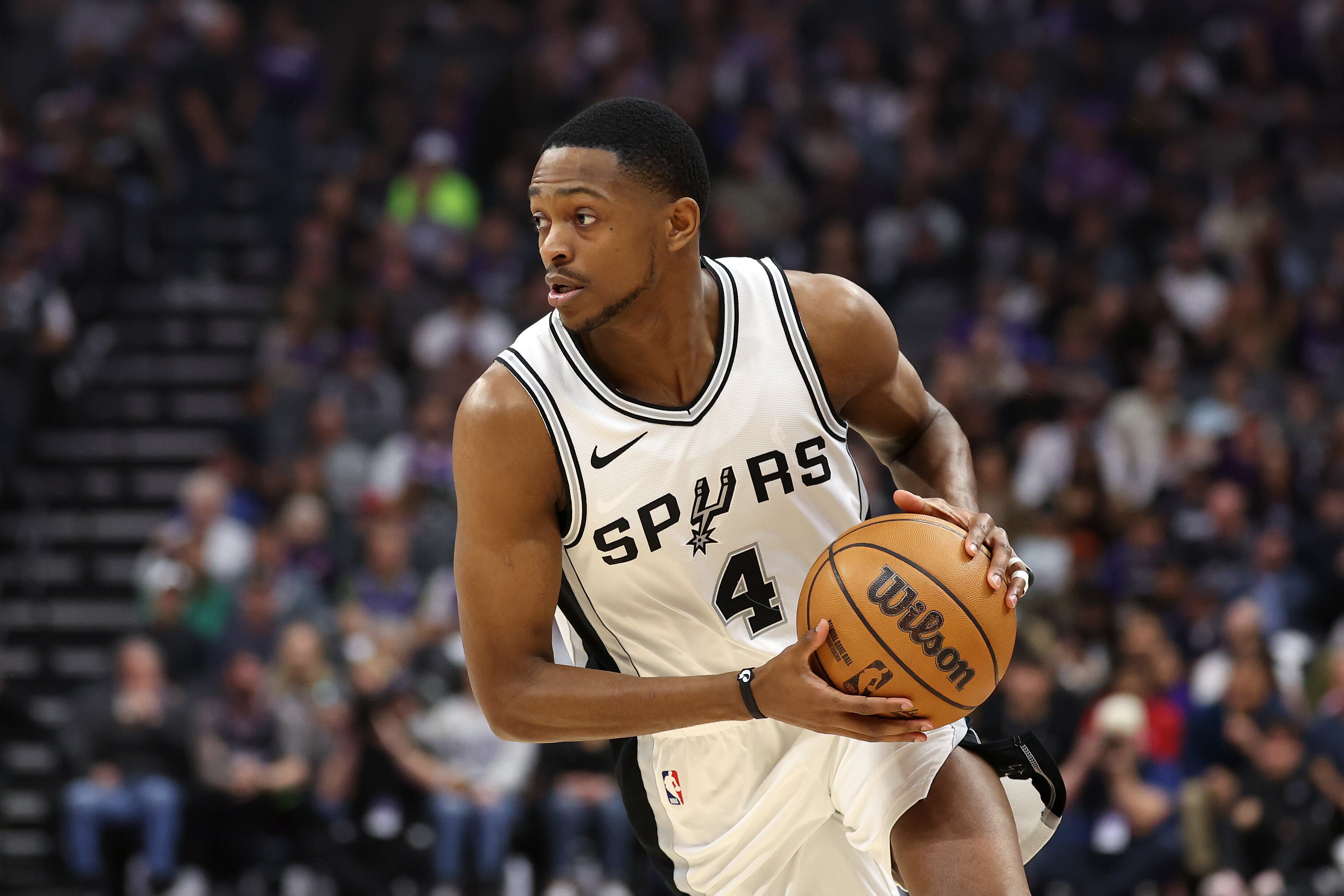 SACRAMENTO, CALIFORNIA - MARCH 07: De'Aaron Fox #4 of the San Antonio Spurs dribbles the ball during their game against the Sacramento Kings at Golden 1 Center on March 07, 2025 in Sacramento, California. The is Fox's first game back in Sacramento after being traded from the Kings. NOTE TO USER: User expressly acknowledges and agrees that, by downloading and/or using this photograph, user is consenting to the terms and conditions of the Getty Images License Agreement.   (Photo by Ezra Shaw/Getty Images)