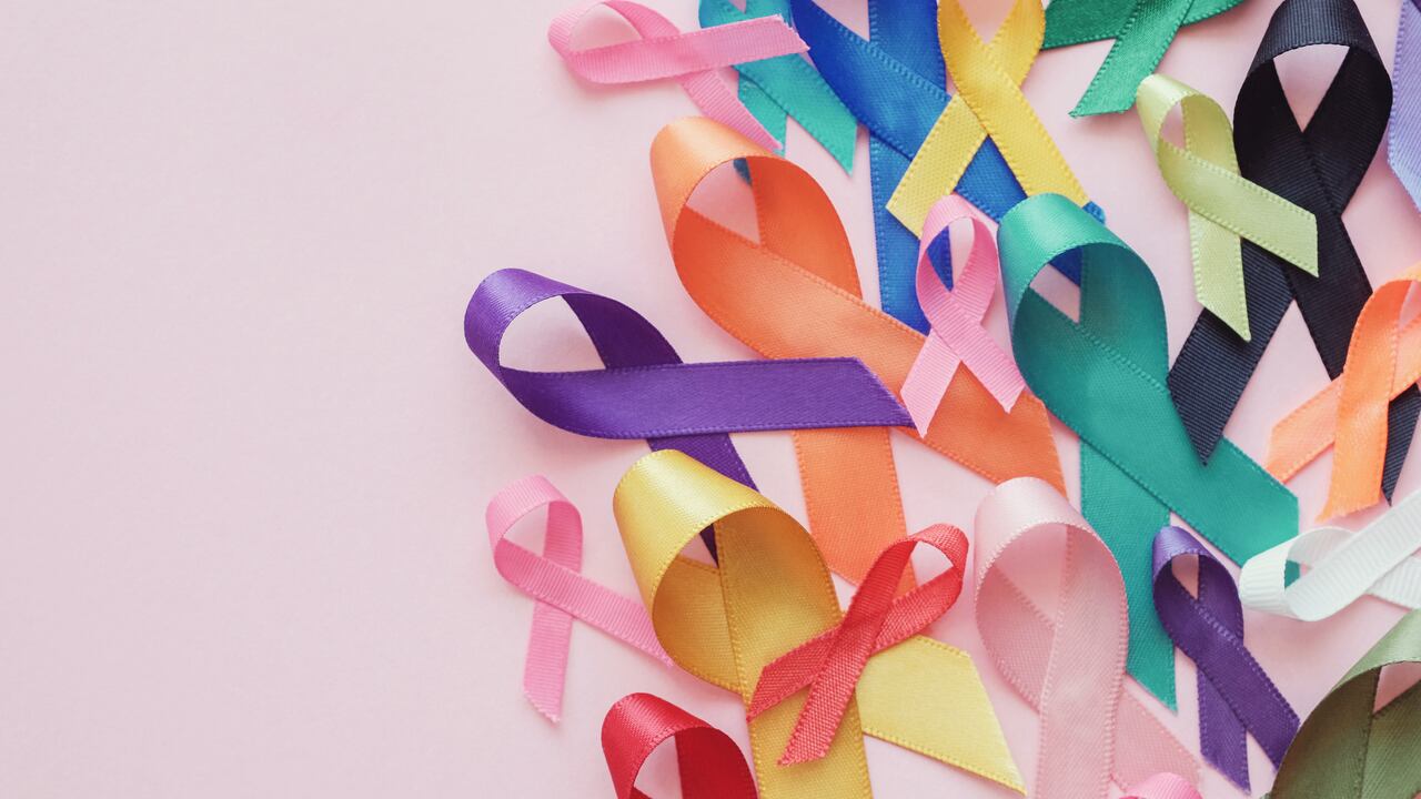 colorful ribbons on pink background, cancer awareness, World cancer day