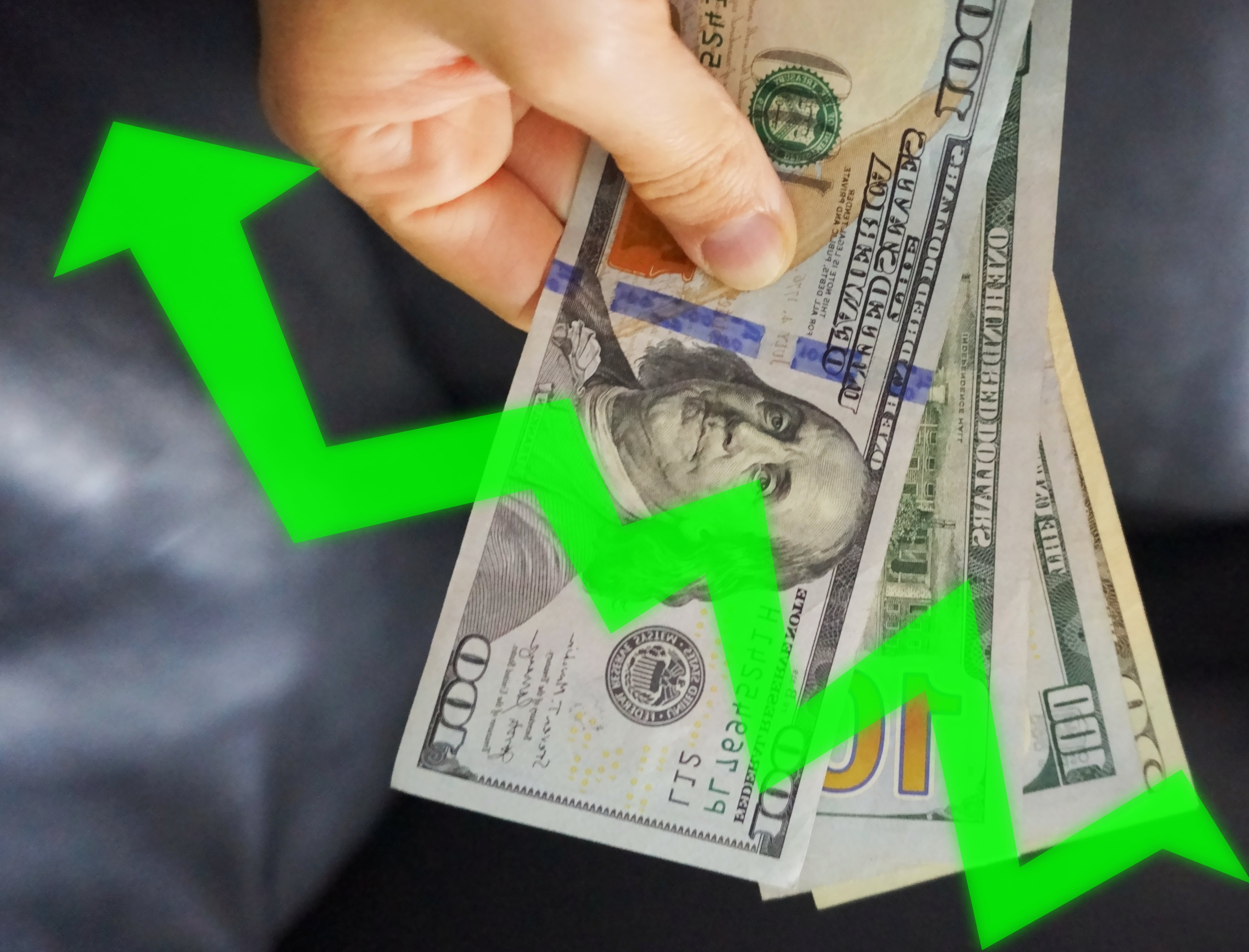 Profits, increase in the dollar rate, improvement of the economy, greater investment, greater spending. A person holding some dollars.