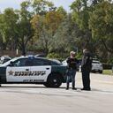 SUNRISE, FLORIDA - FEBRUARY 02: Law enforcement officers block off an area near where reports indicate that several FBI agents were shot as they served a warrant in a child exploitation case on February 2, 2021 in Sunrise, Florida. The FBI agents were reportedly serving the search warrant at an apartment complex when the shooting took place. Joe Raedle/Getty Images/AFP