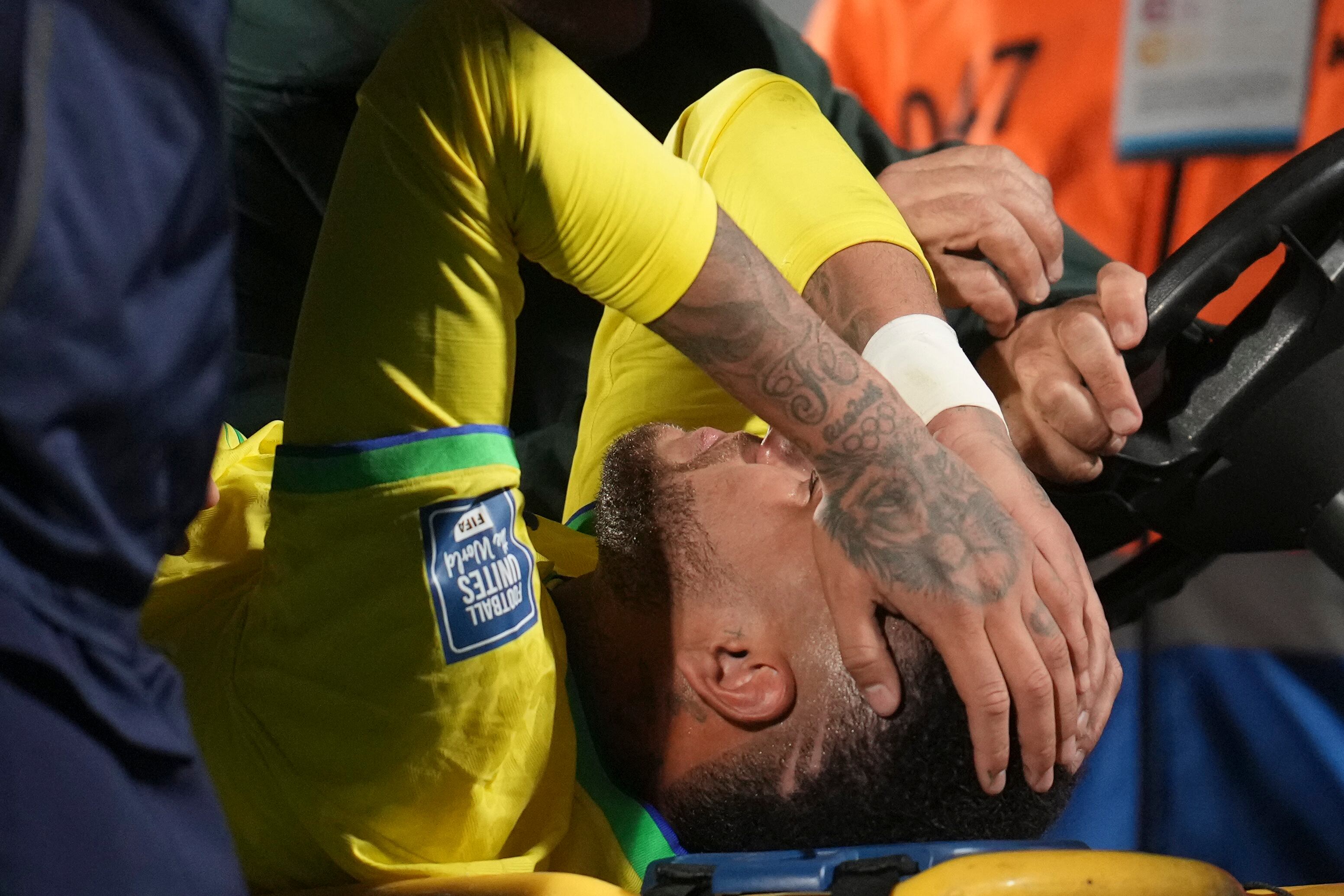 Brazil's Neymar is carried off the pitch on a stretcher after being injured during a qualifying soccer match for the FIFA World Cup 2026 against Uruguay at Centenario stadium in Montevideo, Uruguay, Tuesday, Oct. 17, 2023. (AP Photo/Matilde Campodonico)