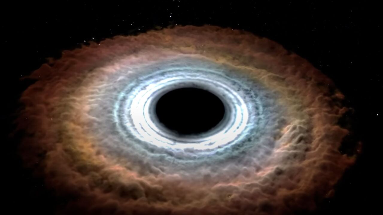 Reconstrucción de cómo un agujero negro se traga a una estrella.