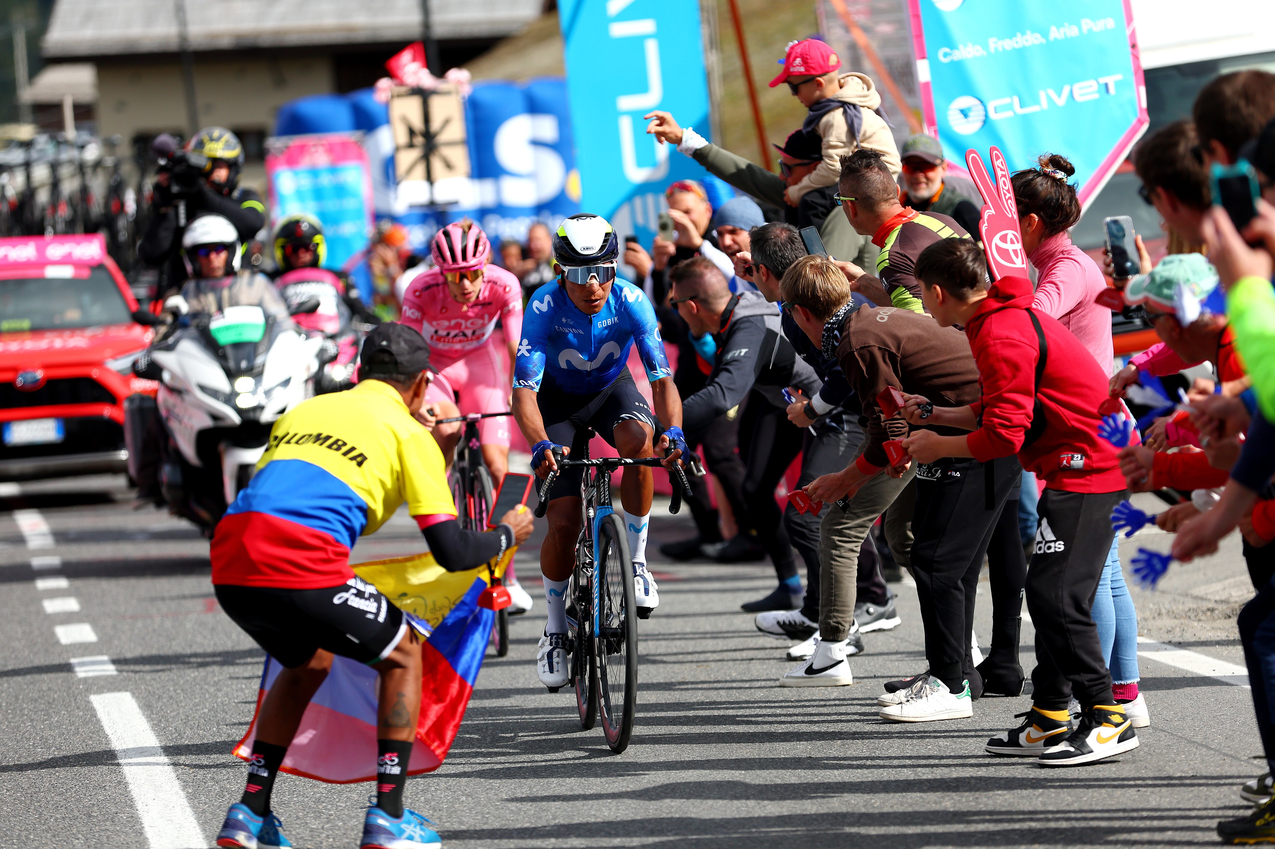 LIVIGNO - MOTTOLINO, ITALY - MAY 19: (L-R) Tadej Pogacar of Slovenia and UAE Team Emirates - Pink Leader Jersey and Nairo Quintana of Colombia and Movistar Team compete in the breakaway climbing the Mottolino (2387m) while fans cheer during the 107th Giro d'Italia 2024, Stage 15 a 222km stage from Manerba del Garda to Livigno - Mottolino 2387m / #UCIWT / on May 19, 2024 in Livigno - Mottolino, Italy. (Photo by Luca Bettini - Pool/Getty Images)