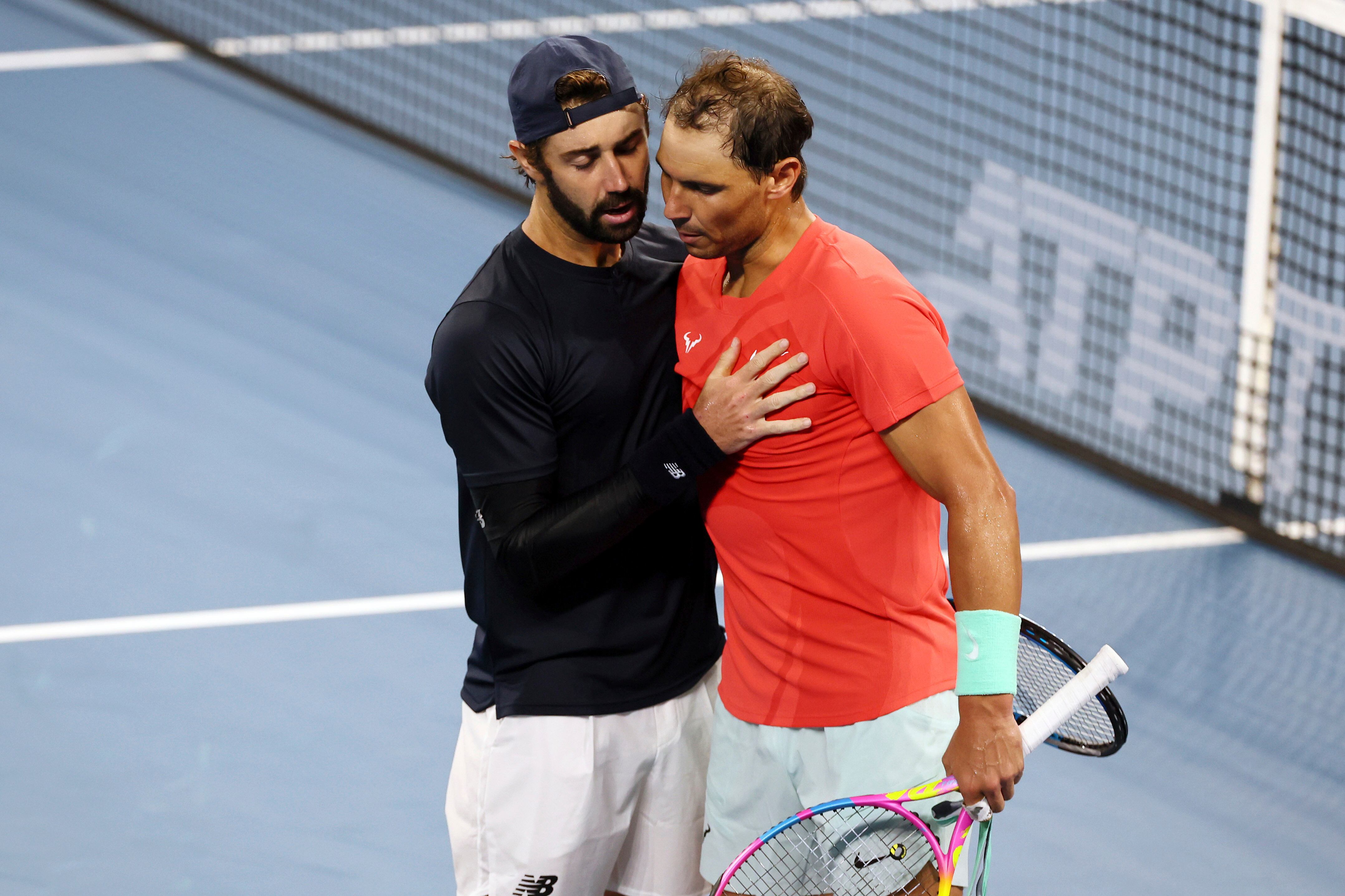Jordan Thompson of Australia shakes hands with Rafael Nadal of Spain after he won his quarter-final match 5-7, 7-6, 6-3, during the Brisbane International tennis tournament in Brisbane, Australia, Friday, Jan. 5, 2024. (AP Photo/Tertius Pickard)