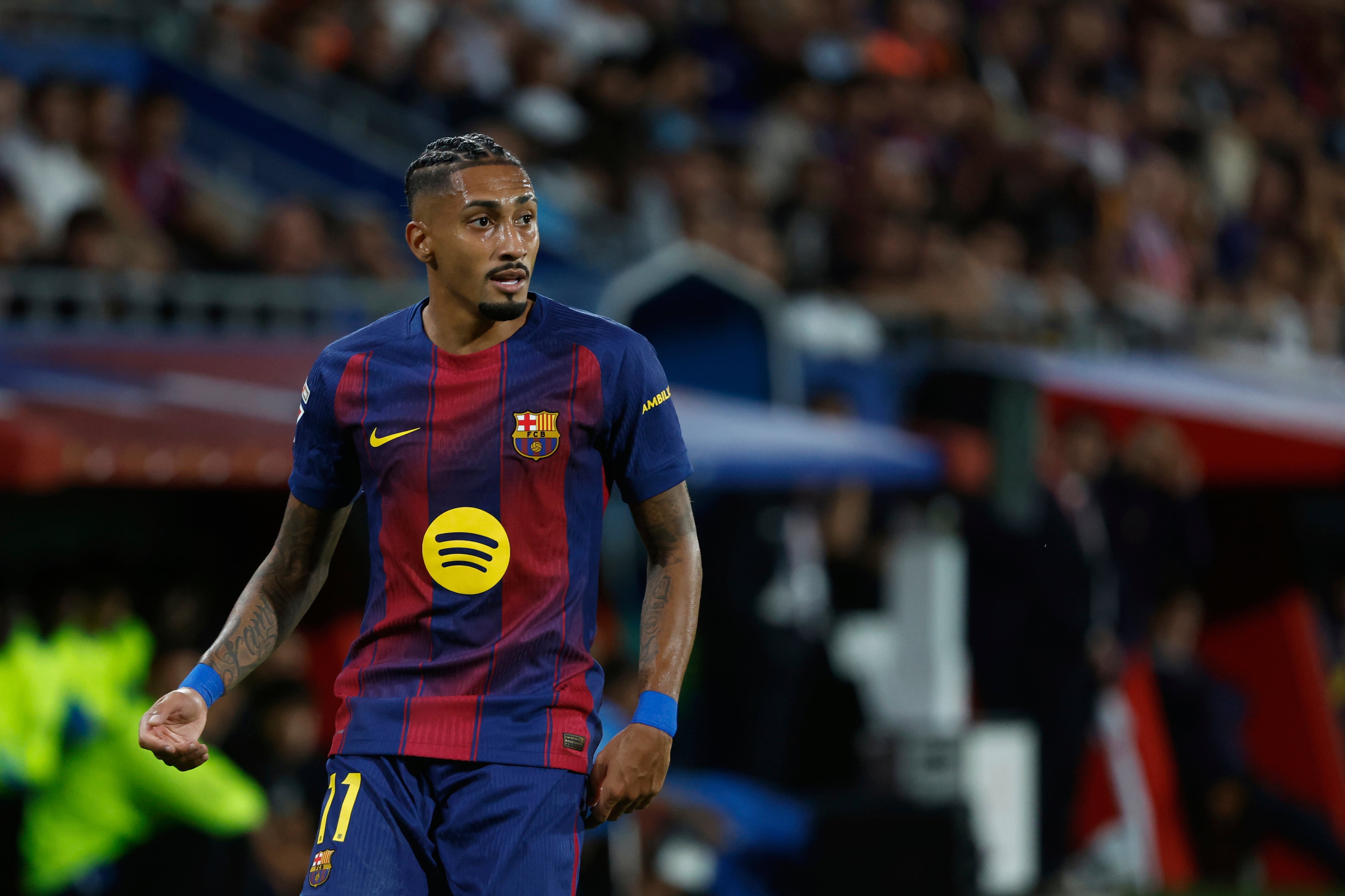Barcelona's Raphinha runs for the ball during a Spanish La Liga soccer match between FC Barcelona and Getafe at the Johan Cruyff stadium in Barcelona, Spain, Sunday, Sept. 21, 2025. (AP Photo/Joan Monfort)