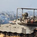 This handout picture released by the Israeli army on November 15, 2023, shows soldiers on an armed vehicle during a military operation around at Al-Shifa hospital in Gaza City, amid continuing battles between Israel and the Palestinian militant group Hamas. (Photo by Israeli Defence Forces / AFP) / RESTRICTED TO EDITORIAL USE - MANDATORY CREDIT "AFP PHOTO / ISRAELI DEFENCE FORCES " - NO MARKETING NO ADVERTISING CAMPAIGNS - DISTRIBUTED AS A SERVICE TO CLIENTS