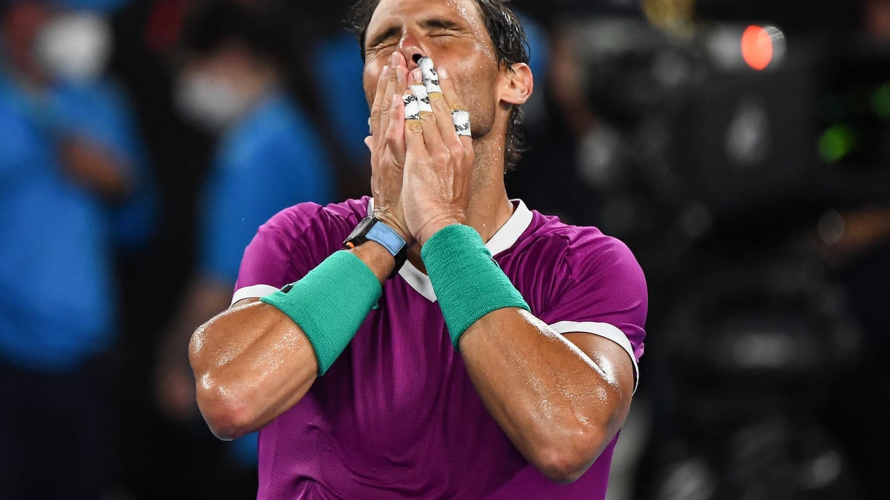 Spain's Rafael Nadal celebrates after victory against Italy's Matteo Berrettini during their men's singles semi-final match on day twelve of the Australian Open tennis tournament in Melbourne on January 28, 2022. (Photo by William WEST / AFP) / -- IMAGE RESTRICTED TO EDITORIAL USE - STRICTLY NO COMMERCIAL USE --