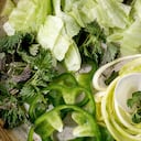 Fresh green raw vegetables and herbs spaghetti zucchini. white radish. green paprika. ice salad for cooking vegan dinner salad. Top view. close up. (Photo by: Natasha Breen/REDA&CO/Universal Images Group via Getty Images)