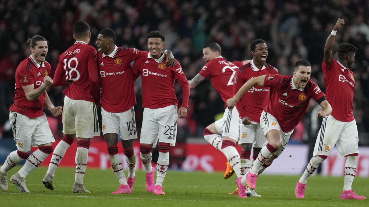 Manchester United players celebrate after winning the English FA Cup semifinal soccer match between Brighton and Hove Albion and Manchester United at Wembley Stadium in London, Sunday, April 23, 2023. (AP/Kirsty Wigglesworth)