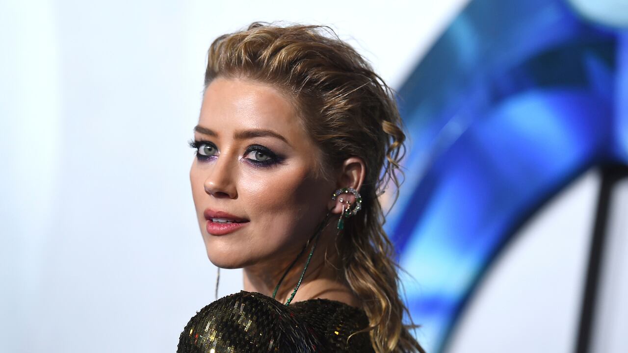 FILE - Amber Heard arrives at the premiere of "Aquaman" on Dec. 12, 2018, in Los Angeles. Heard says she’s become a mom and did it on her own terms, as a single parent. In an Instagram post, the actor said she welcomed daughter Oonagh Paige Heard on April 8, 2021. (Photo by Jordan Strauss/Invision/AP, File)