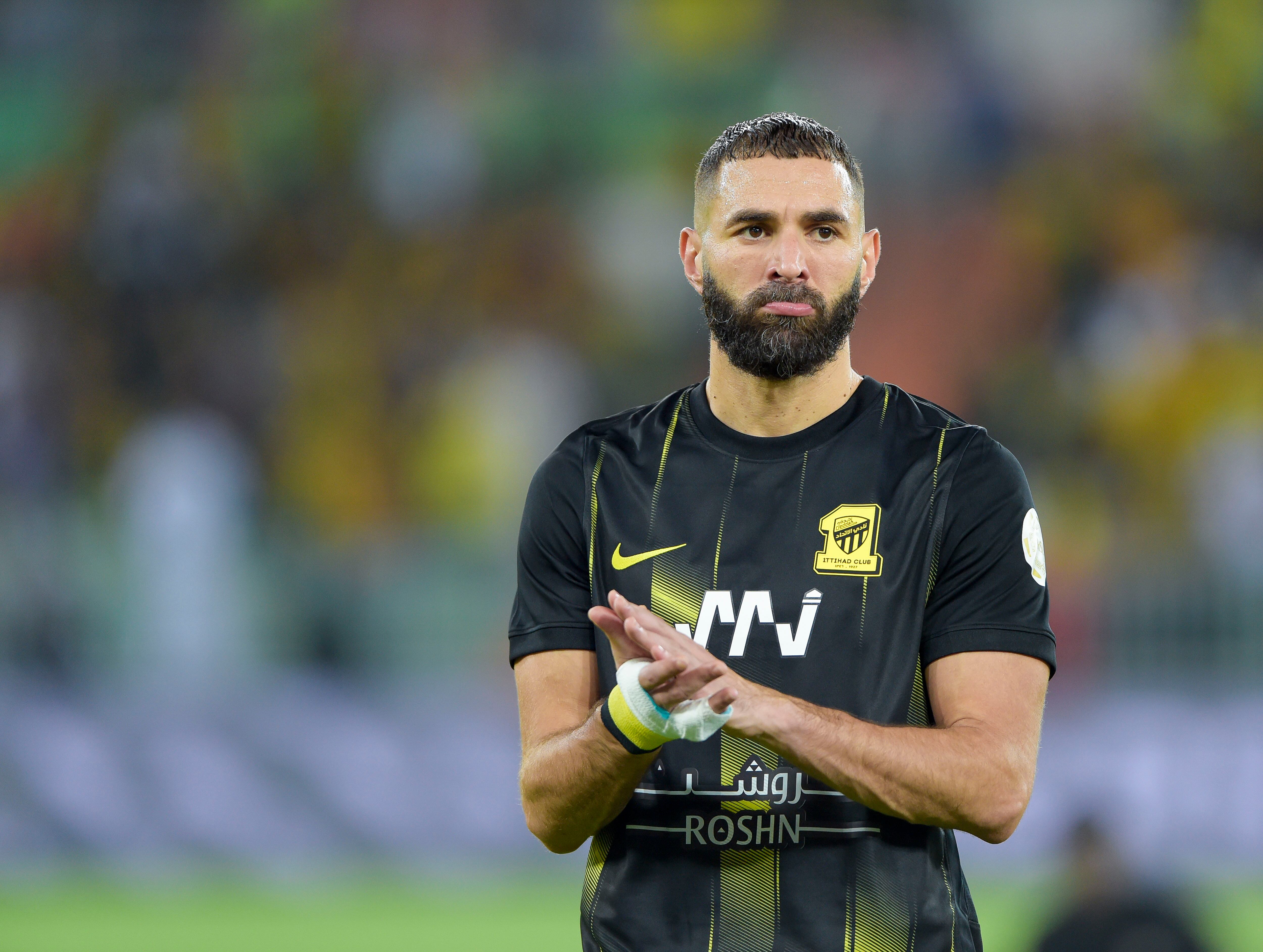 JEDDAH, SAUDI ARABIA - AUGUST 19: Karim Benzema of Al Ittihad applauds before the Saudi Pro League match between Al Ittihad and Al-Tai at Prince Abdullah Al Faisal Stadium on August 19, 2023 in Jeddah, Saudi Arabia. (Photo by Khalid Alhaj/MB Media/Getty Images)