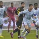 Cristiano Ronaldo, right, playing for a combined XI of Saudi Arabian teams Al Nassr and Al Hilal is challenged by PSG's Lionel Messi during a friendly soccer match, at the King Saud University Stadium, in Riyadh, Saudi Arabia, Thursday, Jan. 19, 2023. (AP Photo/Hussein Malla)