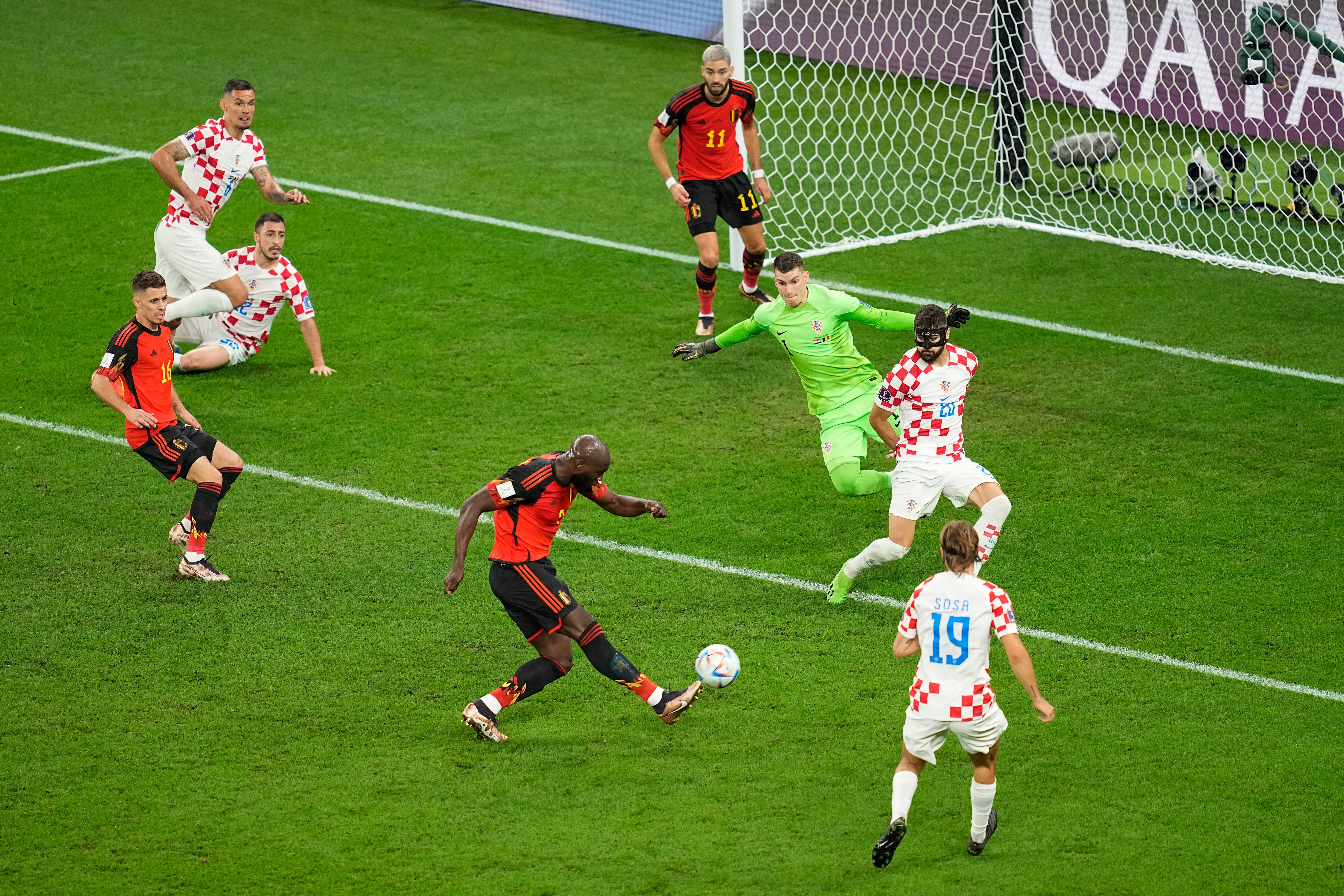 Belgium's Romelu Lukaku, bottom center, gets a shot off against Croatia during the World Cup group F soccer match between Croatia and Belgium at the Ahmad Bin Ali Stadium in Al Rayyan, Qatar, Thursday, Dec. 1, 2022. (AP Photo/Ebrahim Noroozi)