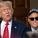 (FILES) In this file photo taken on August 14, 2020, Trump's personal lawyer Rudy Giuliani listens as US President Donald Trump delivers remarks to the City of New York Police Benevolent Association at the Trump National Golf Club in Bedminster, New Jersey.. - Former US president Donald Trump complained on April 29, 2021, that an April 28 FBI raid on the New York apartment of Giuliani was "so unfair." (Photo by JIM WATSON / AFP)
