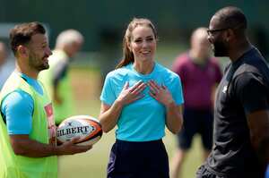 Britain’s Kate, Princess of Wales, center, chats with Danny Care, left, and Ugo Monye during her visit to meet local and national male rugby players at Maidenhead Rugby Club, in Maidenhead, England, Wednesday, June 7, 2023. (Andrew Matthews/PA via AP)