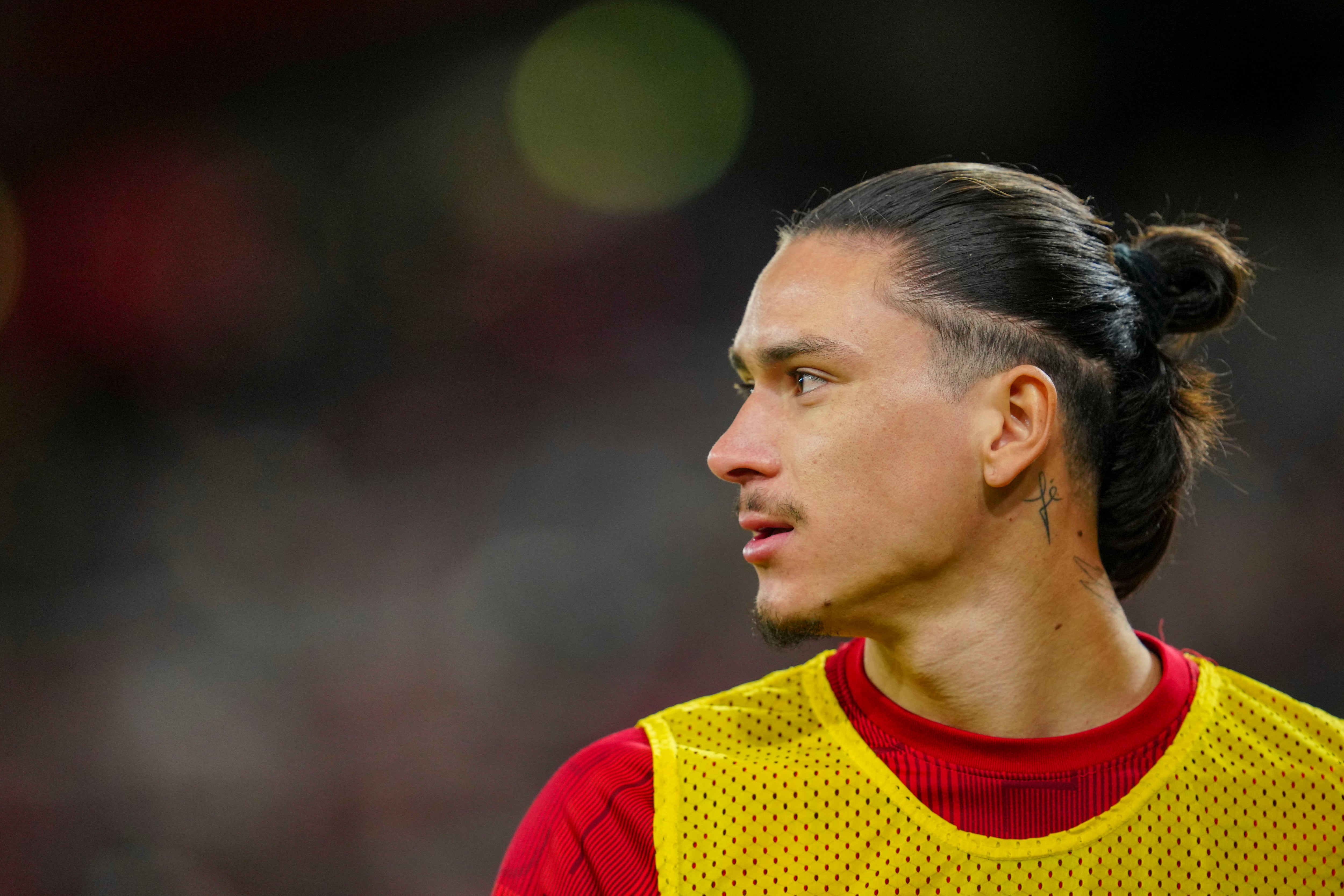 Liverpool's Darwin Nunez warms up during the EFL Cup first leg semi final soccer match between Liverpool and Fulham at Anfield stadium in Liverpool, England, Wednesday, Jan. 10, 2024. (AP Photo/Jon Super)