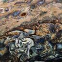 La NASA ha divulgado nuevas imágenes de Júpiter, cuyas tonalidades y formas sugieren la delicadeza de una pintura en acuarela, capturadas por la sonda Juno.