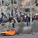 Anti-government protesters gather outside the Alfredo Rodriguez Ballon airport in Arequipa, Peru, Friday, Jan. 20, 2023. Protesters are seeking immediate elections, President Dina Boluarte's resignation, the release of ousted President Pedro Castillo and justice for up to 48 protesters killed in clashes with police. (AP Photo/Jose Sotomayor)