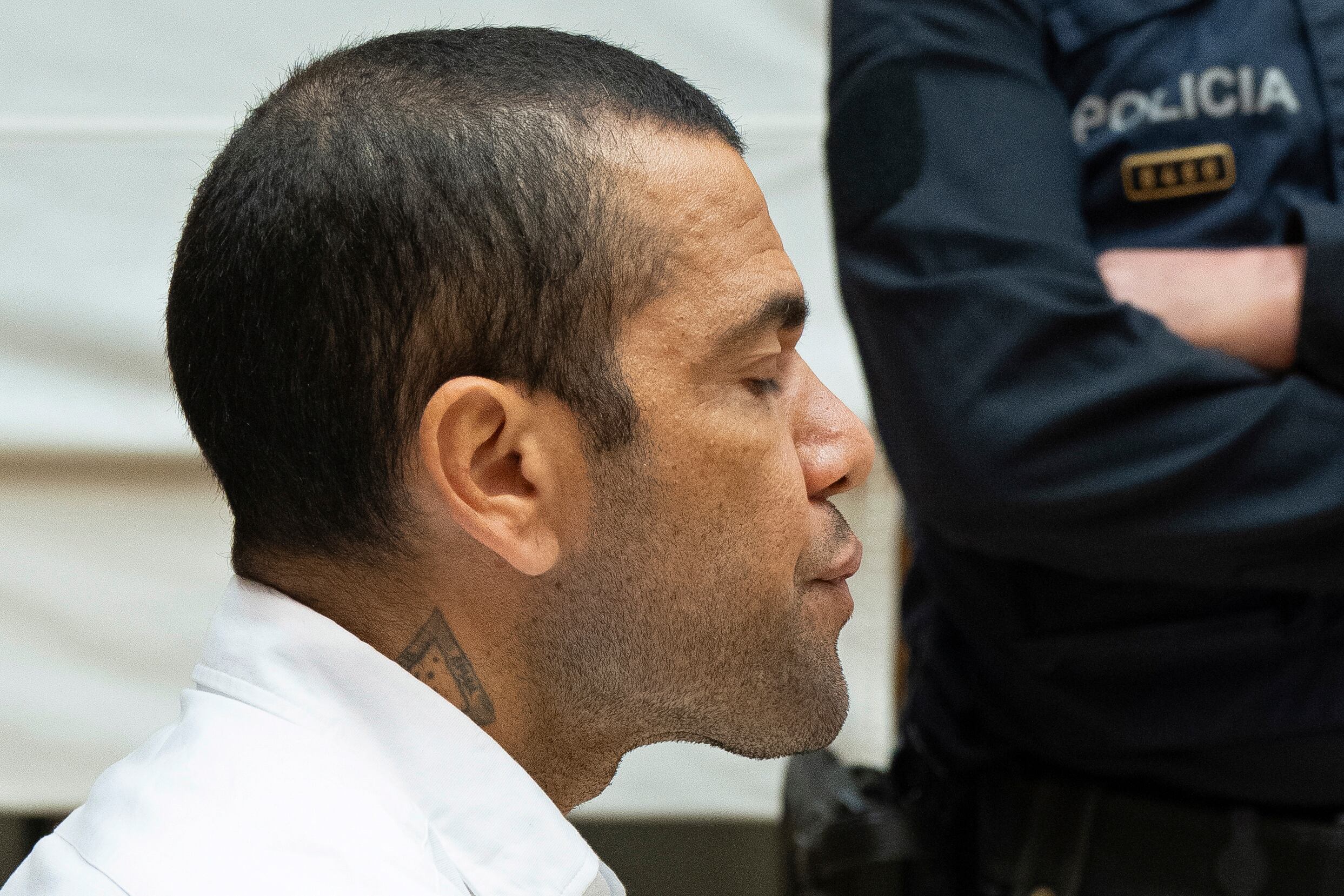 Brazilian soccer star Dani Alves sits during his trial in Barcelona, Spain, Monday, Feb. 5, 2024. Dani Alves goes on trial Monday a year after he allegedly sexually assaulted a young woman at a Barcelona nightclub. The 40-year-old Alves is accused of sexually assaulting the woman on the night of Dec. 30, 2022. He denies any wrongdoing. (D.Zorrakino/Pool Photo via AP)