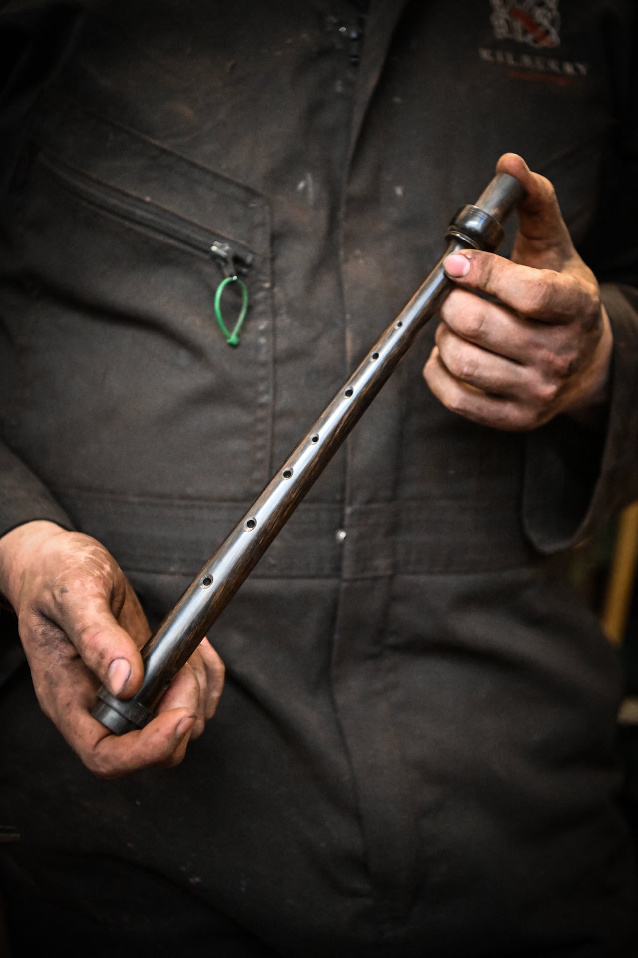Artisan bagpipe maker Ruari Black, the last traditional bagpipe-makers who make everything by hand from start to finish, works on a bagpipe chanter in the workshop of Kilberry Bagpipes in Edinburgh, on October 7, 2024. The Highland bagpipe is an integral part of Scottish culture and history, famous for its distinctive, powerful sound that even accompanied troops as they landed in northern France on D-Day. But the wind instrument is slowly growing silent as demand dwindles and machine-made bagpipes replace traditionally crafted ones, consigning their use to largely ceremonial occasions. Ruari Black is one of only a few remaining craftsmen in Edinburgh who knows how to make the instrument by hand. (Photo by ANDY BUCHANAN / AFP)