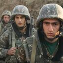 In this image taken from video released by the Armenian Defense Ministry on Wednesday, Sept. 30, 2020, Armenian solders guard their position in the self-proclaimed Republic of Nagorno-Karabakh, Azerbaijan. Armenia's Foreign Ministry in a statement "completely" denied reports of shelling the Dashkesan region and said that with those reports Azerbaijan was laying the groundwork for "expanding the geography of hostilities, including the aggression against the Republic of Armenia." (Armenian Defense Ministry via AP)