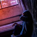 Drugged woman sitting on the floor with substance abuse, substance abuse, addiction, people and drug use concept, copy space background for text.