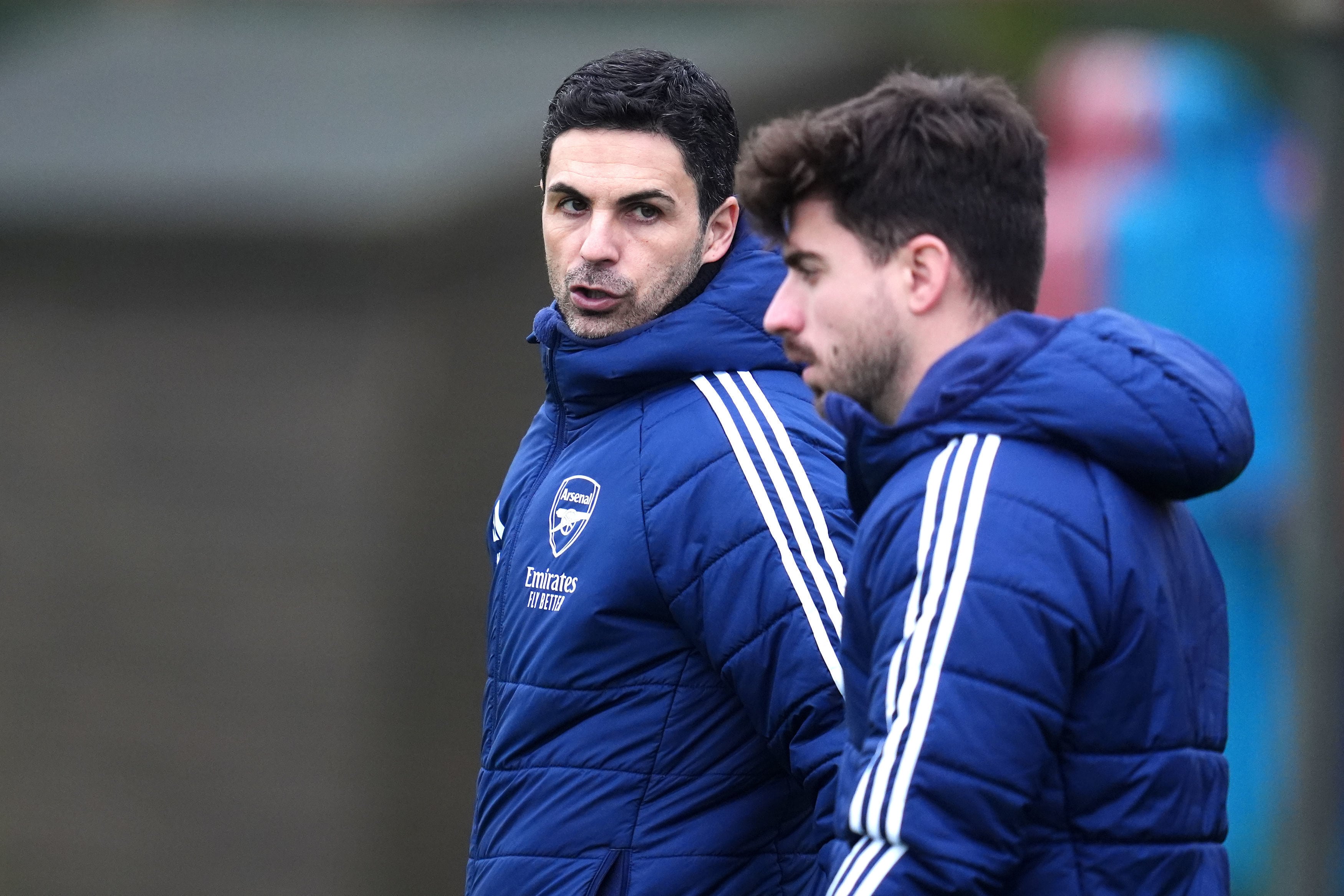 Arsenal manager Mikel Arteta, left, and assistant manager Miguel Molina during a training session in London Colney, Monday Jan. 19, 2026, one day ahead of the Champions League soccer match against Inter. (Adam Davy/PA via AP)