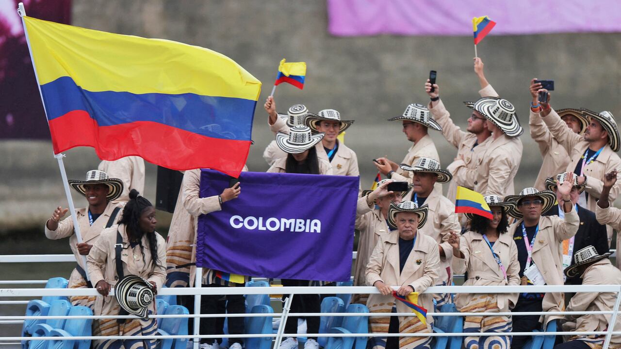 Athletes of Colombia aboard a boat as it makes its way along the Seine in Paris, France, during the opening ceremony for the 2024 Summer Olympics, Friday, July 26, 2024. (Ann Wang/Pool Photo via AP)