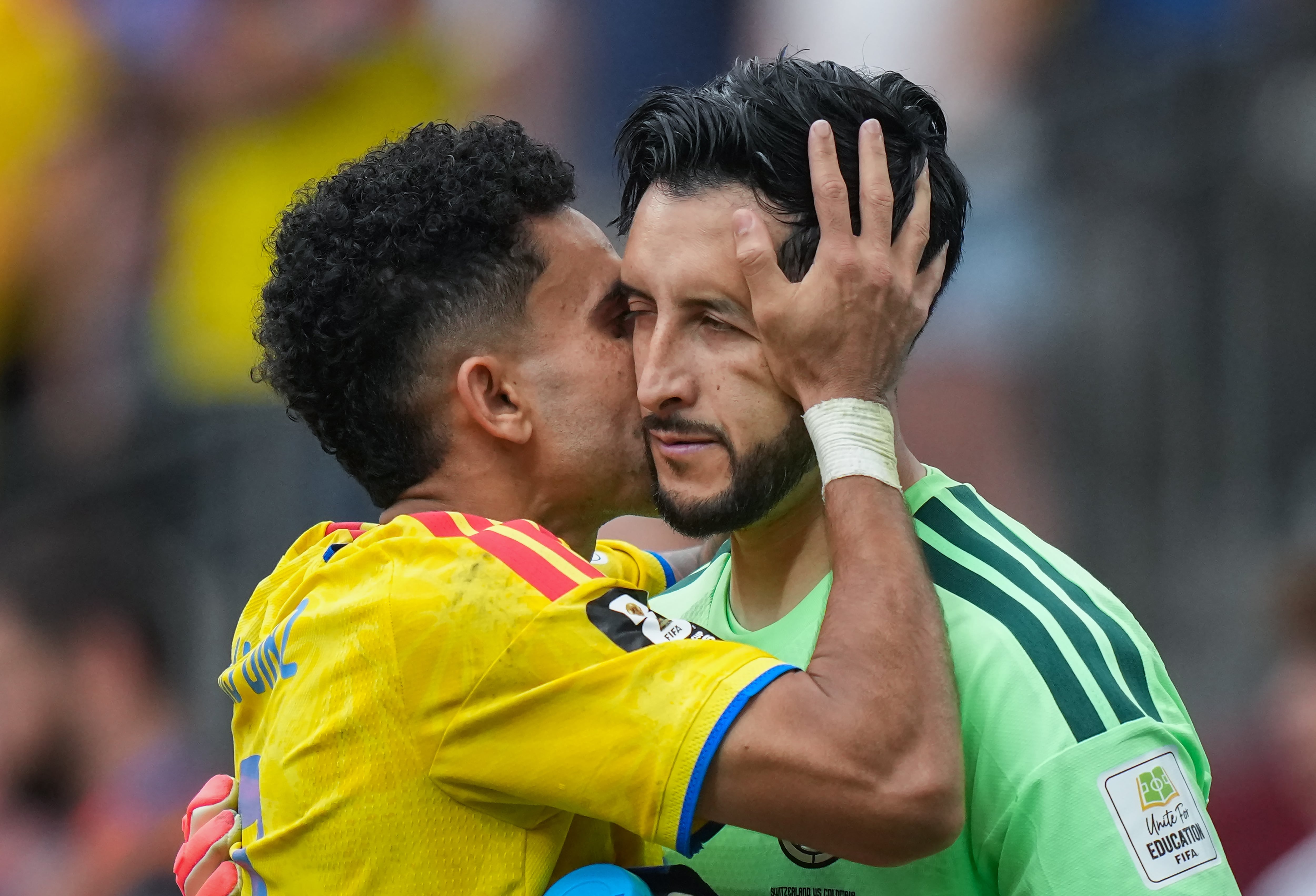 Colombia's Luis Diaz, left, kisses goalkeeper Camilo Vargas during a penalty shootout in the World Cup round of 16 soccer match between Switzerland and Colombia in Vancouver, British Columbia, Tuesday, July 7, 2026. (Darryl Dyck/The Canadian Press via AP)