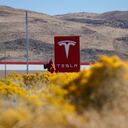 FILE - In this Oct. 13, 2018 file photo, a sign marks the entrance to the Tesla Gigafactory in Sparks, Nev. Tesla CEO Elon Musk solved a mystery involving a 27-year-old Russian who prosecutors say flew to the United States to offer a major-company insider $1 million to assist in a ransomware extortion attack on the firm. According to the billionaire, the scheme took aim at the electric car company’s 1.9 million-square-foot factory in Sparks, Nevada, which makes batteries for Tesla vehicles and energy storage units. (AP Photo/John Locher, File)