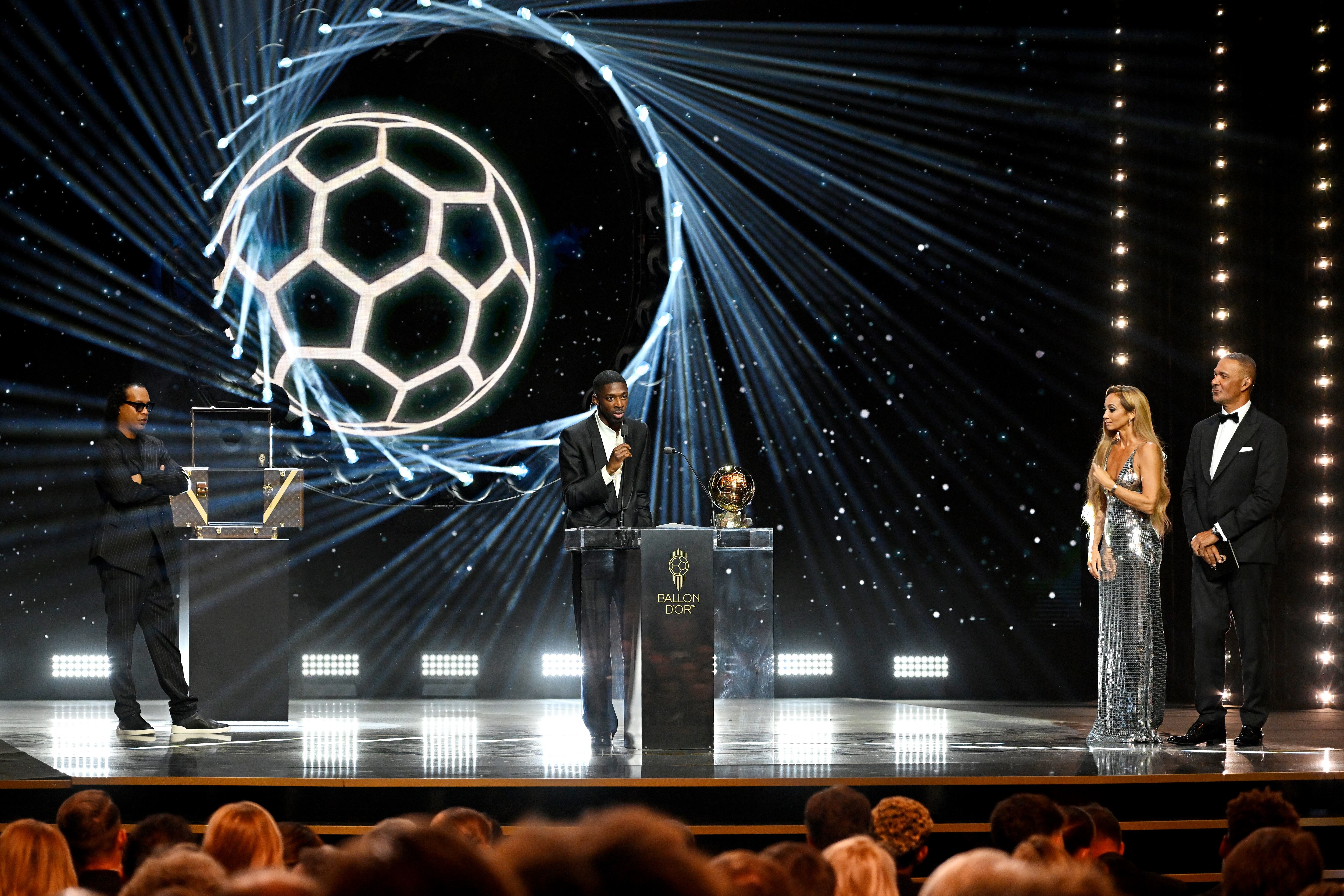 PARIS, FRANCE - SEPTEMBER 22: Ousmane Dembele speaks on stage with the Men’s Ballon d’Or trophy during the 69th Ballon D'Or Ceremony at Theatre Du Chatelet on September 22, 2025 in Paris, France. (Photo by Kristy Sparow - UEFA/UEFA via Getty Images)