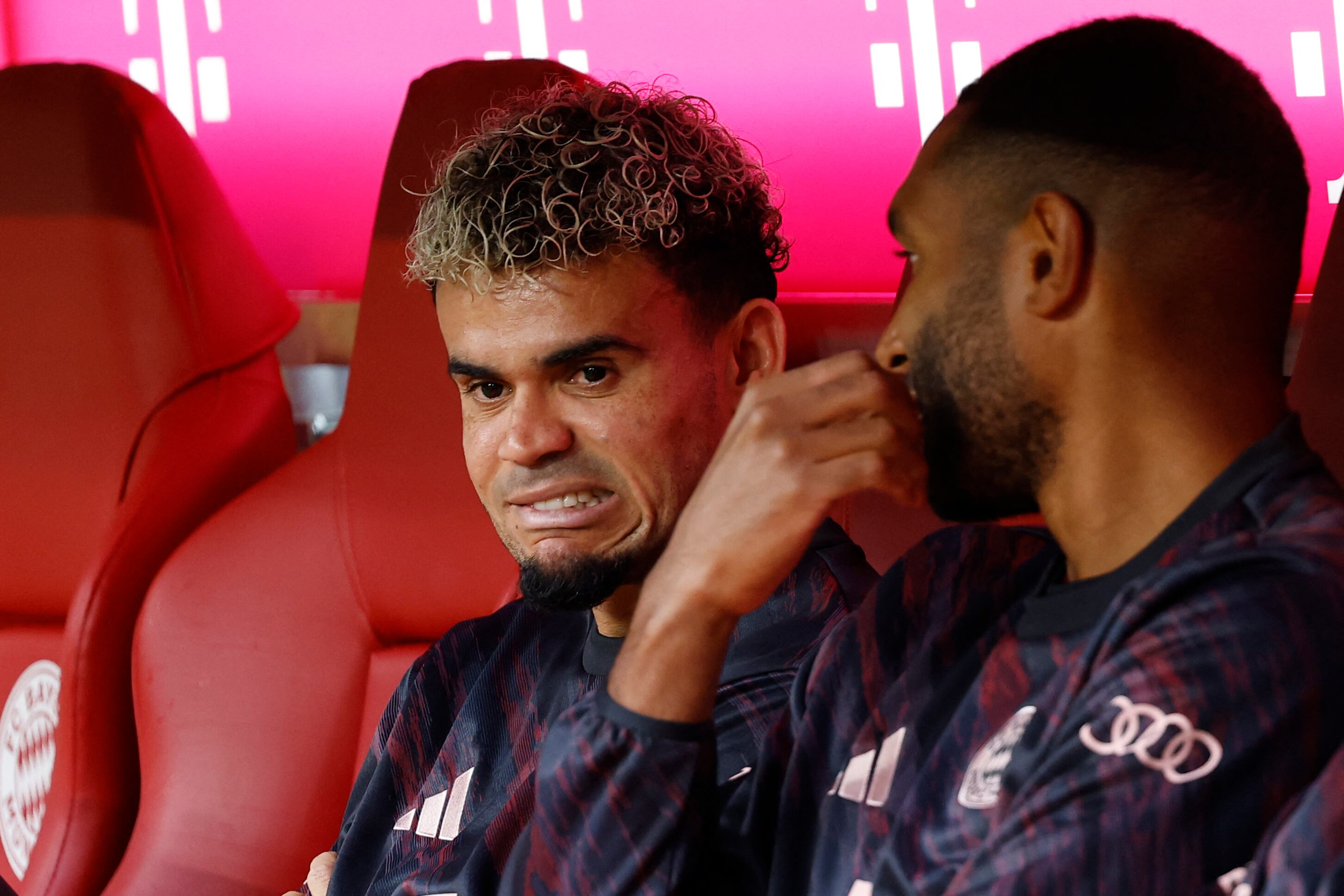 Bayern Munich's Colombian forward #14 Luis Diaz (L) taks to Bayern Munich's German defender #04 Jonathan Tah prior to the friendly football match between Bayern Munich and Olympique Lyon in Munich, southern Germany, on August 2, 2025. (Photo by Alexandra BEIER / AFP)