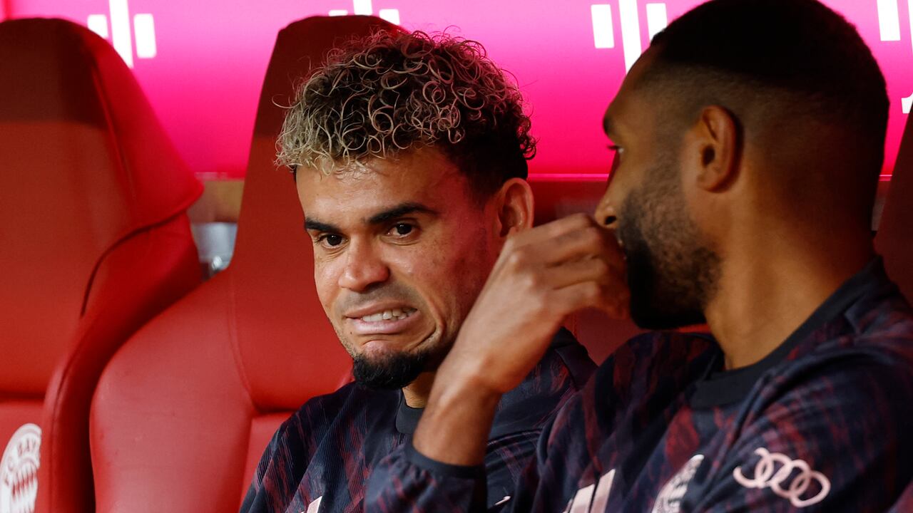 Bayern Munich's Colombian forward #14 Luis Diaz (L) taks to Bayern Munich's German defender #04 Jonathan Tah prior to the friendly football match between Bayern Munich and Olympique Lyon in Munich, southern Germany, on August 2, 2025. (Photo by Alexandra BEIER / AFP)