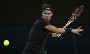 Rafael Nadal of Spain plays a forehand during his singles match against Ricardas Berankis of Lithuania at Summer Set tennis tournament ahead of the Australian Open in Melbourne, Australia, Thursday, Jan. 6, 2022. (AP Photo/Hamish Blair)