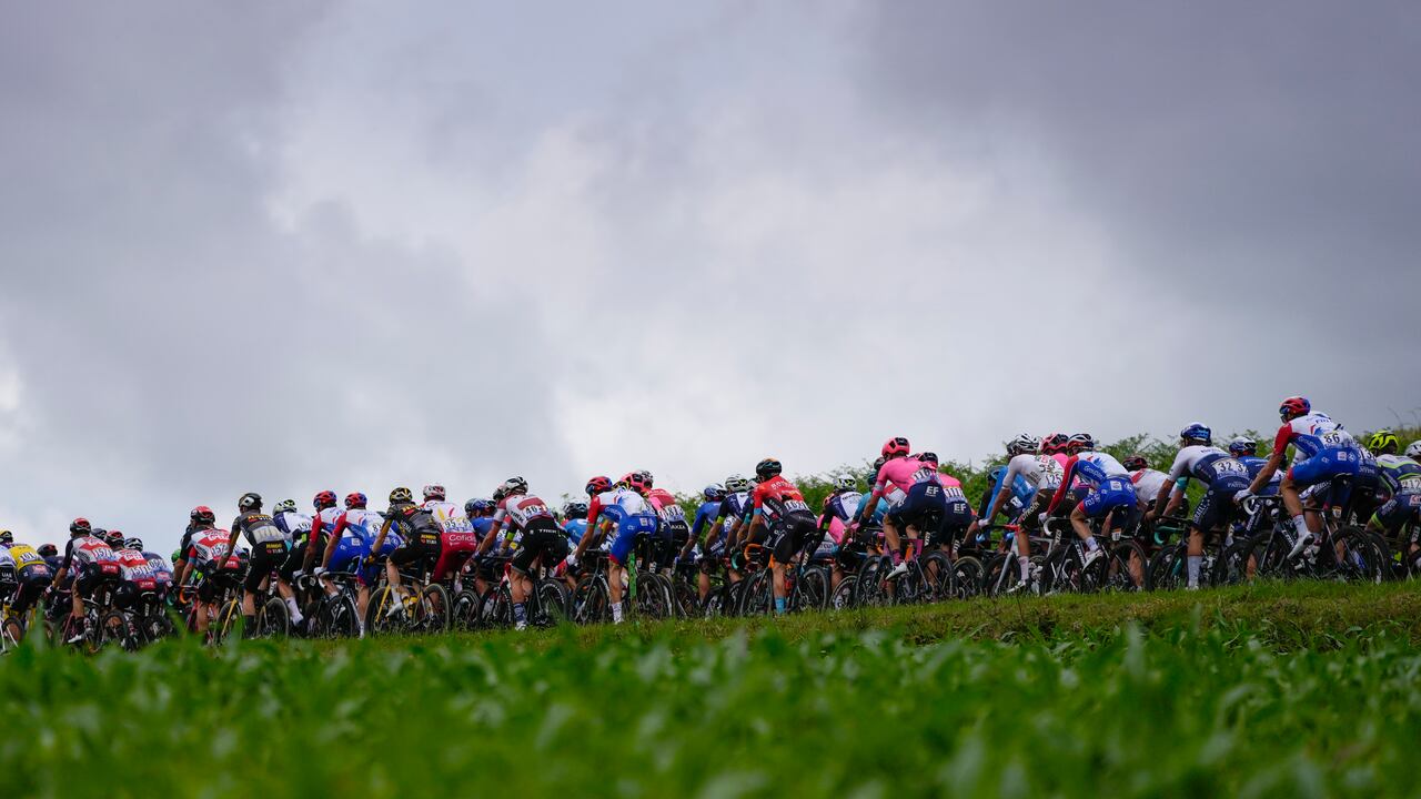 The pack rides during the third stage of the Tour de France cycling race over 182.9 kilometers (113.65 miles) with start in Lorient and finish in Pontivy, France, Monday, June 28, 2021. (AP Photo/Daniel Cole)